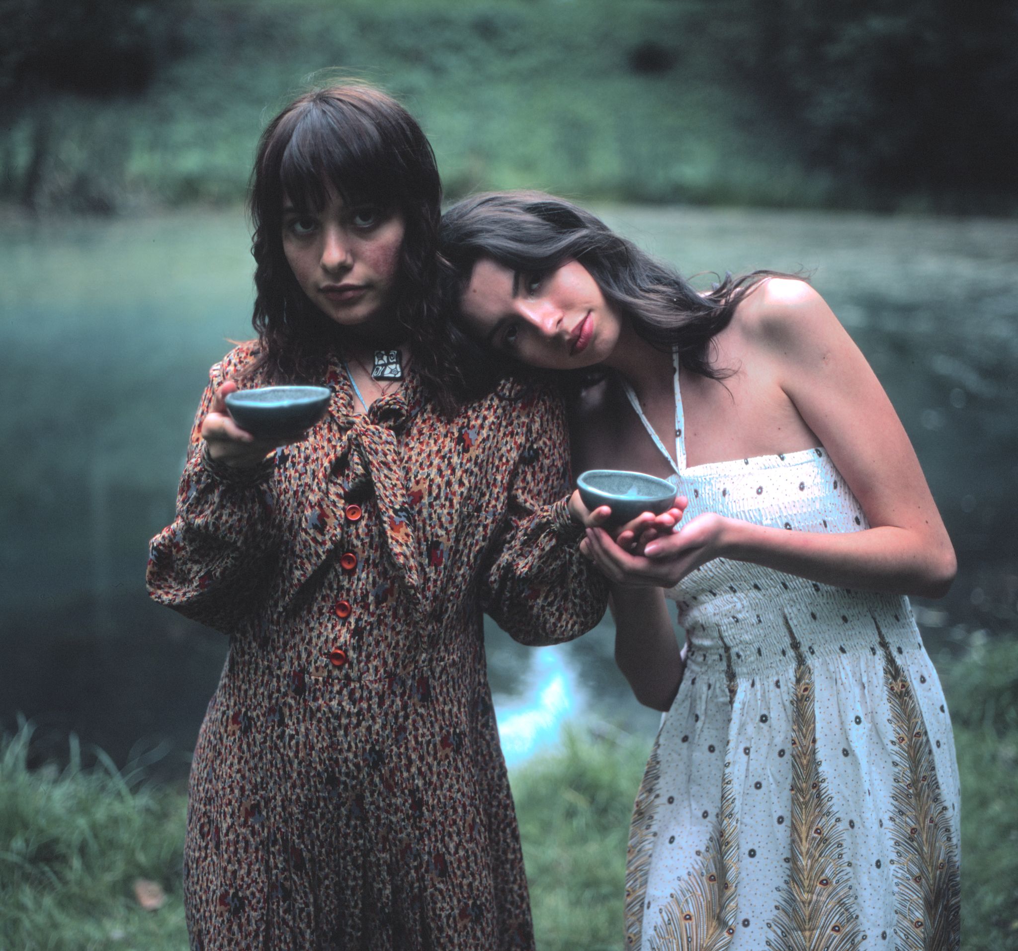 Two girls with tea in front of a radioactive lake